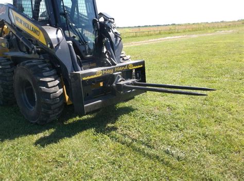 carry bales of hay with 1845c skid steer|hay and forage skid steer.